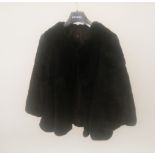 A BLACK FUR JACKET.