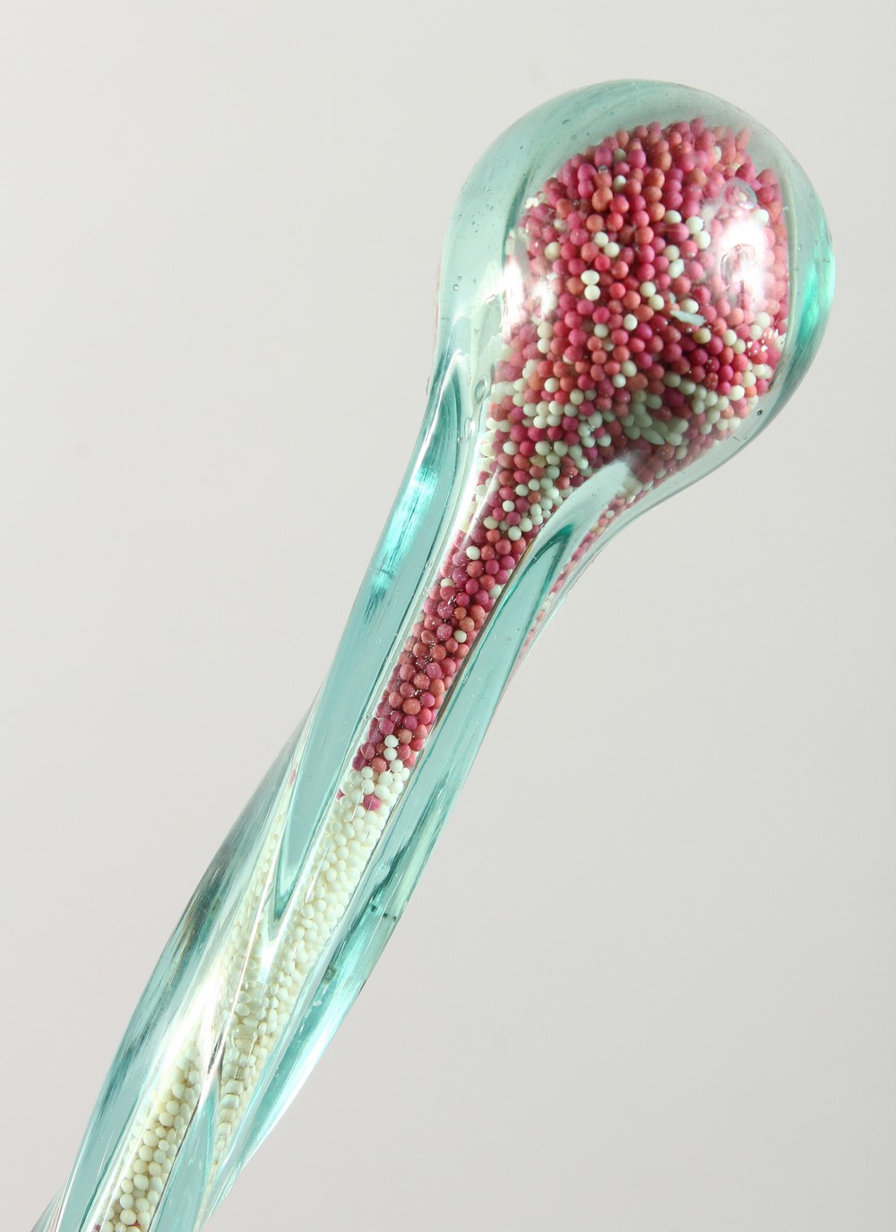 A LONG NAILSEA SPIRAL TWIST GLASS WALKING STICK, inside are thousands of tiny beads.