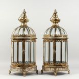 A PAIR OF GOLD COLOUR HANGING LANTERNS. 24ins high.