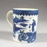 AN 18TH CENTURY CAUGHLEY MUG, decorated with an Oriental figure holding a fish in under-glaze