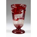 A 19TH CENTURY BOHEMIAN RUBY GLASS GOBLET, engraved with a deer in a landscape. 5ins high.