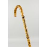 AN UNUSUAL SEGMENTED BONE WALKING STICK. 2ft 10ins long.