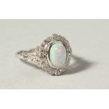 A SILVER, GILSON OPAL AND PASTE DRESS RING.