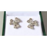 A PAIR OF 18CT WHITE GOLD FLOWER HEAD EARRINGS.