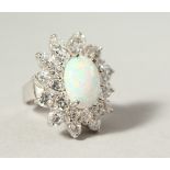 A LARGE SILVER, GILSON OPAL AND BRILLIANT COCKTAIL RING.