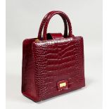 A GAIA GREY AND MAROON SNAKESKIN BAG, in a Gaia bag.