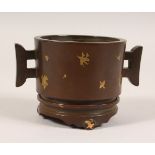 A GOLD SPLASH BRONZE TWIN HANDLED CENSER on stand. 5.5ins wide.