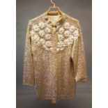 A SEQUIN WHITE CREAM JACKET.