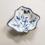 AN 18TH CENTURY LOWESTOFT LEAF SHAPED DISH, painted with vines in under-glaze blue.