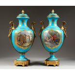 A SUPERB LARGE PAIR OF SEVRES BLUE GROUND TWO-HANDLED URN SHAPED VASES, painted with reverse