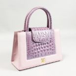 AN ORNOIR OF KUWAIT MAUVE BAG.