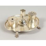 A GOOD SMALL OVAL SHAPED INKSTAND with candlestick and two silver bottles. London 1911. Maker: