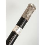 A SILVER MOUNTED LEATHER COVERED WALKING CANE. 2ft 11ins long.