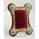 A RUSSIAN SILVER GILT AND ENAMEL DECORATED PHOTOGRAPH FRAME. 9.25ins high x 7ins wide.