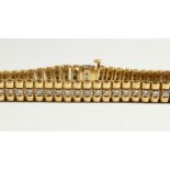 A GOOD 14K GOLD AND DIAMOND BRACELET.