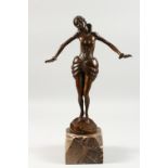 AN ART DECO STYLE BRONZE FEMALE FIGURE, her arms held out, on a shaped marble base. 18.5ins high.