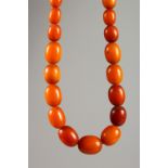 AN AMBER NECKLACE. 1ft 10ins long. 47gms.