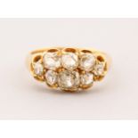 AN 18CT GOLD EIGHT STONE DIAMOND CLUSTER RING.