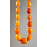 A LONG AMBER NECKLACE. 3ft long. 80gms.