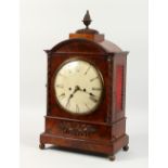 A LATE REGENCY MAHOGANY BRACKET CLOCK, with white dial, brass grilled sides and pineapple finial.