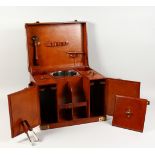A LEATHER PICNIC HAMPER, with fitted interior. 17.5ins wide.