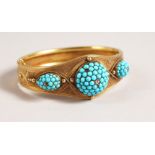 A VICTORIAN GOLD AND TURQUOISE BRACELET.