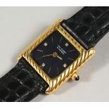 A LADIES' 18CT GOLD VAN CLEEF & ARPELS WRISTWATCH with black face and four diamonds, with leather