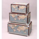 A SET OF THREE RECTANGULAR TRUNKS, printed with maps of the world. Largest: 2ft 3ins wide.