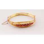 A 9CT GOLD AND RUBY SET BRACELET, 7gms.