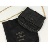 A SMALL BLACK QUILTED SATIN SHOULDER BAG, with gilt chain shoulder strap, and felt bag. 16.5cms