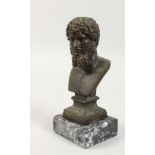 AFTER THE ANTIQUE, a bronze male bust on marble base. 7.5ins high overall.