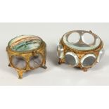 TWO 19TH CENTURY CONTINENTAL GILT METAL AND GLASS JEWELLERY CASKETS. 3.5ins x 4.5ins diameter.