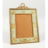 A GOOD FRENCH GILDED PHOTOGRAPH FRAME with garlands and eagle. 13ins high x 10ins wide.