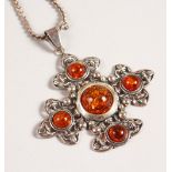 A SILVER AND AMBER PENDANT AND CHAIN.