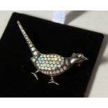 A SILVER AND GOLD, OPAL AND DIAMOND PHEASANT BROOCH.