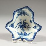 AN 18TH CENTURY WORCESTER PICKLE LEAF DISH, with under-glaze blue vines and flowers, crescent mark.