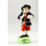 A SMALL DERBY PORCELAIN FIGURE OF WINTER, a boy eating a bowl of porridge, black hat and blue