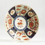 A DR WALL PERIOD CIRCULAR PLATE with Imari-style pattern. Blue square mark. 7.5ins diameter.