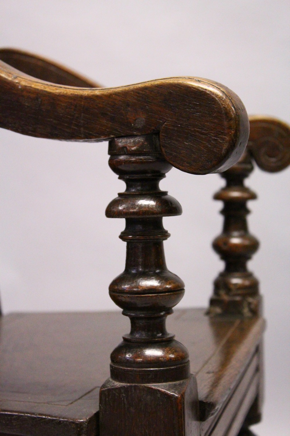 AN 18TH CENTURY OAK WAINSCOT ARMCHAIR, with carved back, solid seat and curving arms and turned - Image 10 of 11