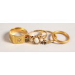 AN 18CT GOLD AND DIAMOND SIGNET RING, 22CT GOLD WEDDING BAND and TWO OTHER RINGS.