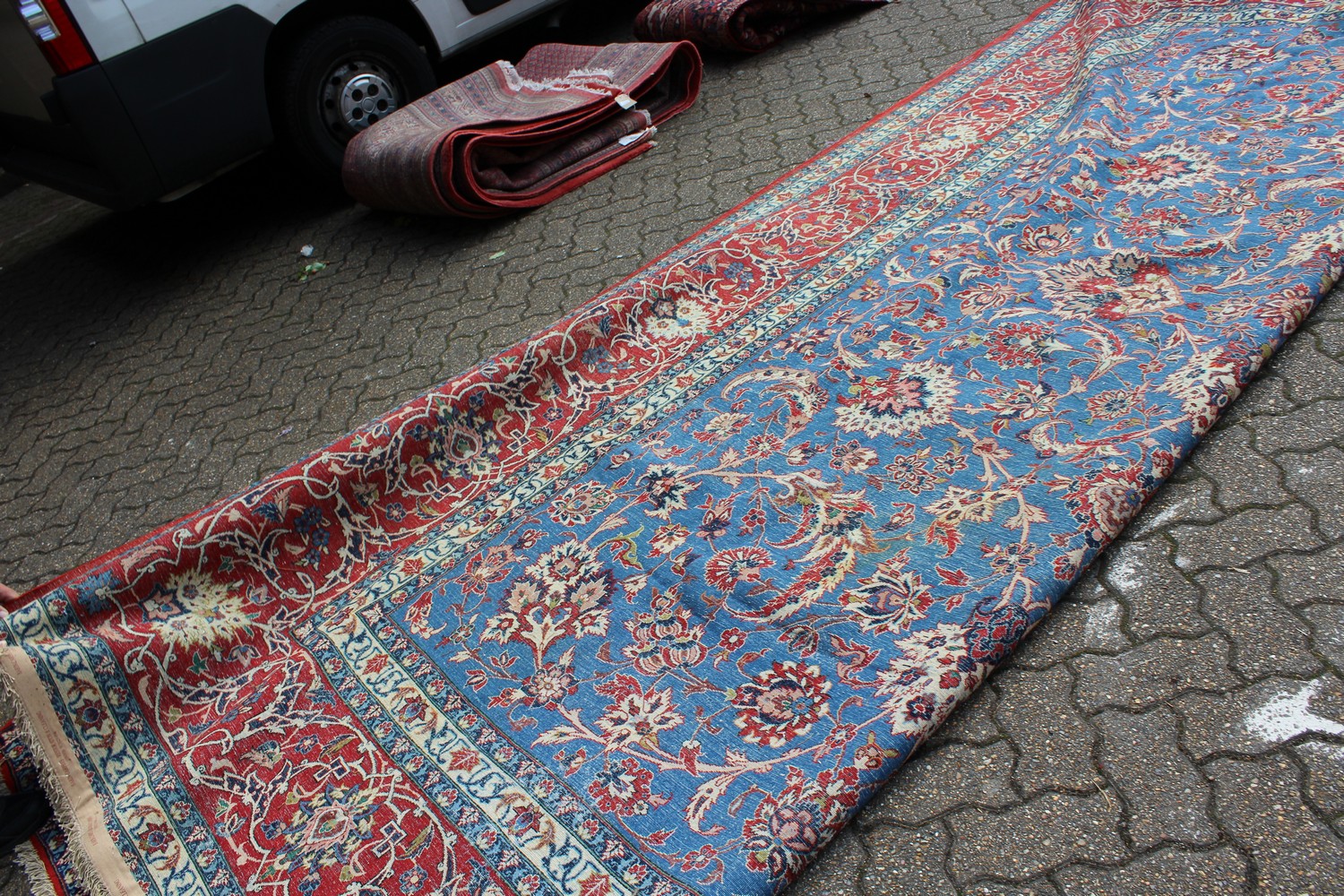 A GOOD LARGE PERSIAN ISFAHAN CARPET, pale blue ground with allover floral design, in a similar red - Image 2 of 2