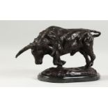 A NATURALISTIC BRONZE MODEL OF A BULL, on a marble base. 14ins long.