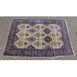 A GOOD PERSIAN CARPET, beige ground with floral medallions and pendants, within a pale blue floral