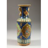 A QAJAR POTTERY VASE, in the Chinese style, decorated with flowers. 11.5ins high.