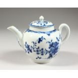 AN 18TH CENTURY SMALL SIZE TEAPOT AND COVER, painted with trailing flowers in under-glaze blue,