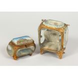 A 19TH CENTURY SOUVENIR GILT METAL AND GLASS JEWELLERY CASKET AND SIMILAR POCKET WATCH HOLDER.