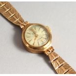 A LADIES' 9CT GOLD ROTARY WRISTWATCH AND BRACELET. 13 grams including works.