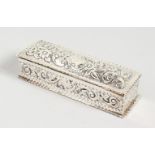A RECTANGULAR BOX AND COVER with repousse decoration. Birmingham 1901. 5ins long.