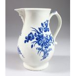AN 18TH CENTURY WORCESTER MASK JUG, with under-glaze blue flowers (extended firing crack to spout).