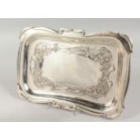 A GOOD ART DECO SILVER RECTANGULAR DISH, repousse with flowers and scrolls. 12.5ins long. London